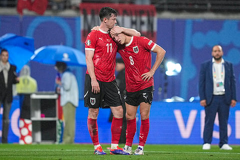 Michael Gregoritsch comforts Alexander Prass